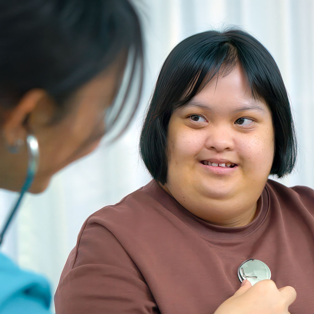 Young woman receiving a checkup from her doctor